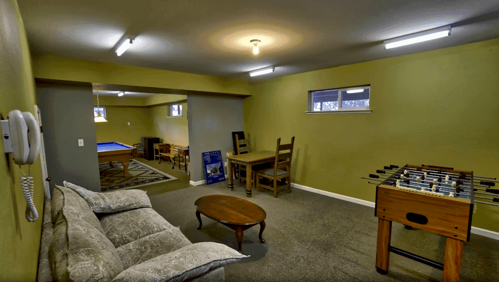 game room with foosball and pool tables