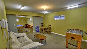 game room with foosball and pool tables