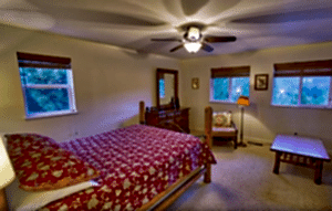 primary bedroom with red bedding