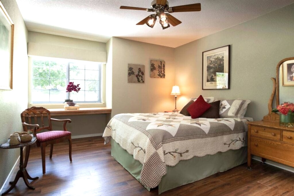 sage room with queen bed