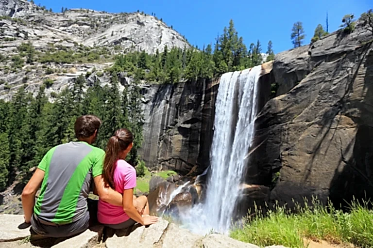 Couple hiking near waterfall