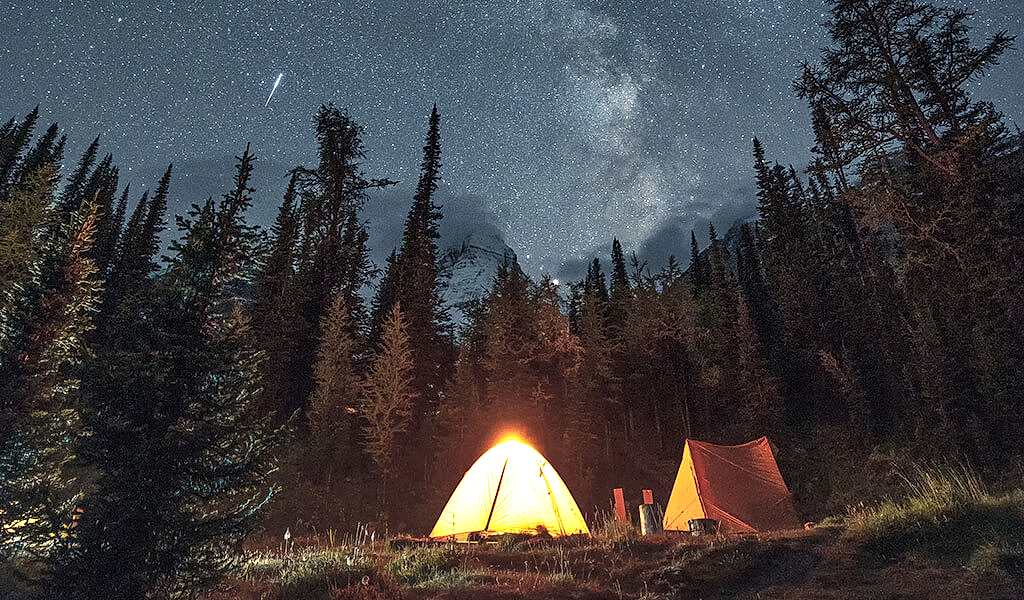 lighted tents under the stars