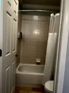 bathroom with tub shower